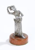 Chinese white metal statue, of a dancing figure on a hardwood stand, 13cm high
