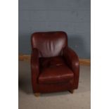 Art Deco style brown leather club chair, with curved arms, raised on square tapering legs