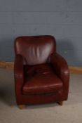 Art Deco style brown leather club chair, with curved arms, raised on square tapering legs
