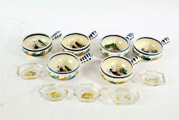 Set of six Quimper pottery cups, all painted with figures, and five small glass and enamelled dishes