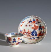 Lowestoft Redgrave style porcelain tea bowl and saucer decorated in the dolls house pattern,