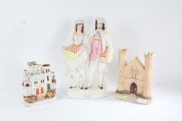 19th century Staffordshire figure group 'Orange Sellers', 36cm tall, and two others of architectural