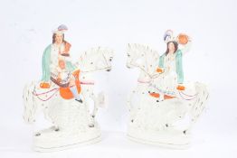Pair of Victorian Staffordshire figures, in the form of a Scottish couple, each on horseback and one