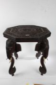 Anglo-Indian carved hardwood occasional table, the octagonal top carved with a God within