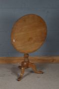 19th century pine tilt top occasional table, raised on knopped column and tripod legs, 68cm