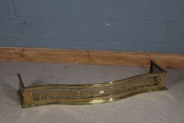 Victorian Brass fire fender, with a bobbin turned effect with shell decoration, 124cm wide