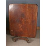 Victorian mahogany breakfast table, the rectangular tilt top with rounded corners raised on a