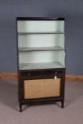 Regency ebonised waterfall bookcase, with three shelves above a frieze drawer and grille fronted