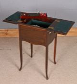 Late Victorian mahogany sewing table, the hinged flaps enclosing an interior with lift out tray