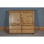 Pine hanging cupboard, the two panelled cupboard doors opening top reveal a shelf and two small