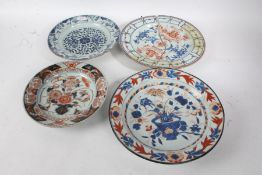 Three 19th century Japanese Imari plates, (one AF), the largest 32cm diameter, and a blue and