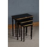 Chinese style nest of tables, with three graduation tables painted in black with gold accents, the