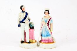 Pair of Victorian porcelain figures, in the form of Prince Albert and Queen Victoria (both AF), 13.