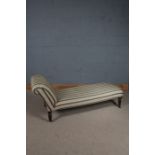 Victorian chaise longue, upholstered in a blue banded and foliate material, raised on turned legs