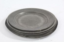 Four 18th century pewter plates, one dated 1792 to the base, the largest 26.5cm diameter (4)