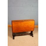 Victorian mahogany Sutherland table, the narrow top flanked by two drop leaves, raised on baluster