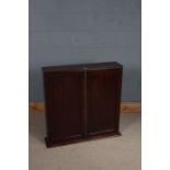 Victorian mahogany wall cabinet, the two panelled cupboard doors opening to reveal two adjustable