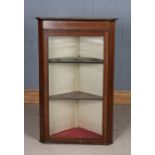 Edwardian mahogany and marquetry inlaid hanging corner cupboard, the glazed door opening to reveal