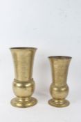 Two ecclesiastical bronze vases, the taller stamped Diadem to foot, the smaller with inscription,