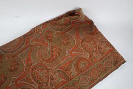 Paisley style throw, predominantly in red and green scrolls, approx. 166cm square