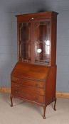 Edwardian mahogany and inlaid bureau bookcase, the upper section having a pair of astragal glazed