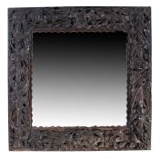 Heavily carved 19th Century oak framed mirror, 70.5cm x 70cm