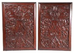 Pair of 19th Century heavily moulded oak panels, decorated with foliate scrolls and fruits, 67cm x