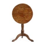 George III oak wine tilt top table, of small proportions, the circular tilt top above a turned