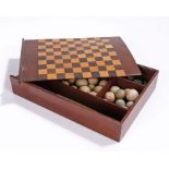 Early 19th Century games box, the chequer inlaid sliding lid opening to reveal a storage compartment