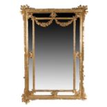 19th Century gilt gesso wall mirror, the central rectangular mirror plate with foliate spandrels and
