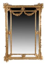19th Century gilt gesso wall mirror, the central rectangular mirror plate with foliate spandrels and