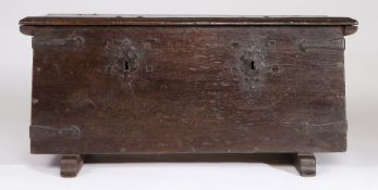 17th Century German oak strong box, the rectangular top above twin locks and iron straps flanked