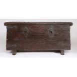 17th Century German oak strong box, the rectangular top above twin locks and iron straps flanked