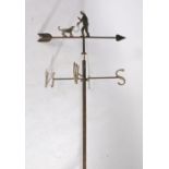 Metal weather vane, with a man with his dog, N.S.E.W. by blacksmith Graham Chaplin, 200cm long