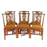 Set of six George III oak dining chairs, later carved, the shaped top rail above a splat back and