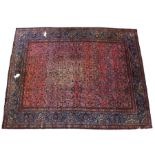 Khorasan carpet, with all over beige and blue flowers on red field, within blue border, 433cm long x