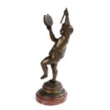 19th Century bronze figure, of a dancing putto playing the tambourine above a stepped base on a