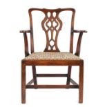 George III mahogany armchair, the undulating top rail above a pierced vase splat and drop in seat