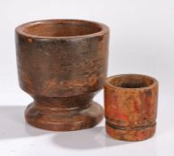 Two 19th Century Indian mortars, the first with a wide bowl above a dumpy column and wide foot,