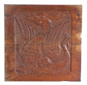 19th Century relief carved oak panel portraying a cockatrice, 46cm x 47cm