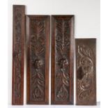 Pair of 19th Century oak panels with carved feathered faces, an 18th Century panel and a further
