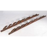 19th Century Spanish oak sword rack, the two uprights with undulating carvings and star motifs,