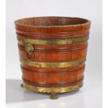 19th Century peat bucket, with gilt metal straps and lion masks with hoop handles above lion paw