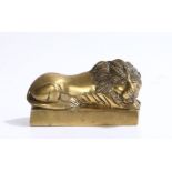 Unusual 19th Century brass lion, the chimney ornament as a resting with lion on a plinth base,
