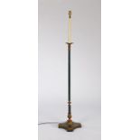 Regency style standard lamp, painted in green with gilt metal fittings above a platform base and