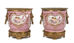 Pair of gilt mental mounted porcelain cachepots, the gilt metal bead top above a pink ground