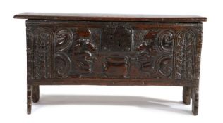 Rare early 17th Century oak boarded coffer, West Country, the rectangular top with dog-tooth and dot