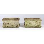 Pair of composite garden planters, rectangular form with flower and scroll bodies, 45cm long, 27cm