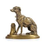 Victorian bronze, of a dog seated by a post above an oval plinth base, 13cm high