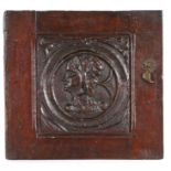 16th Century carved oak Romayne panel, with a profile facing right inside a circular frame and